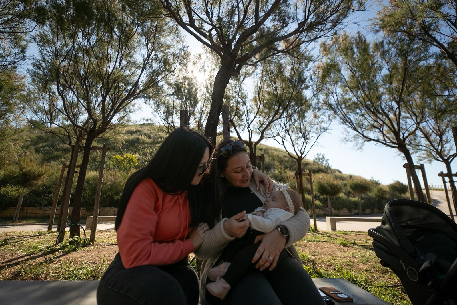 Family sitting together with a baby