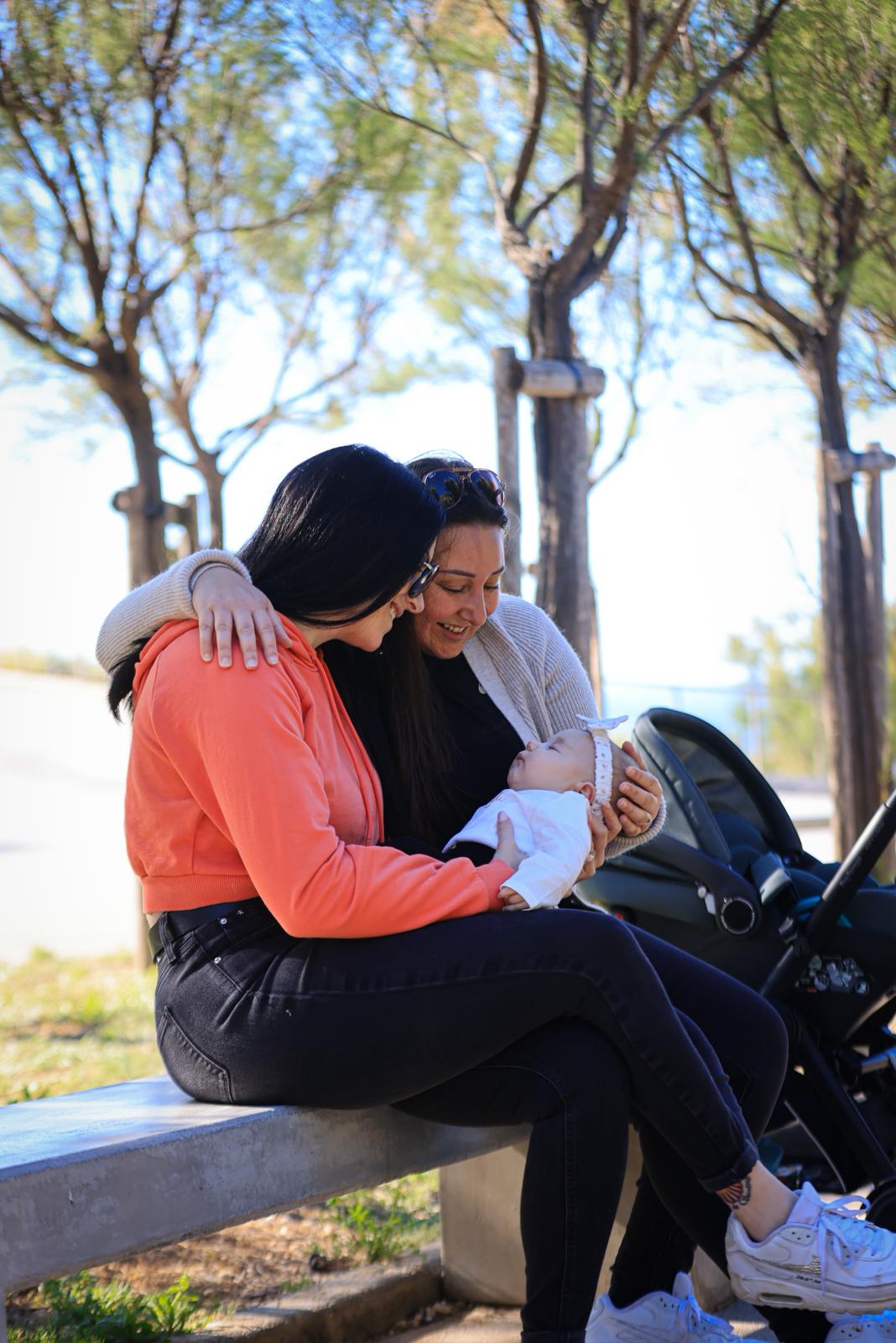 Family sharing a tender moment with a baby